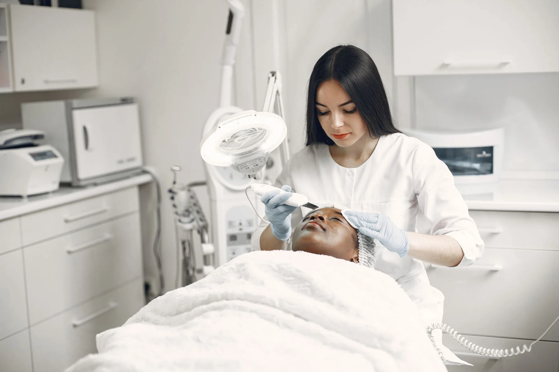 NEODERM aesthetician performing clinical skin renewal treatment